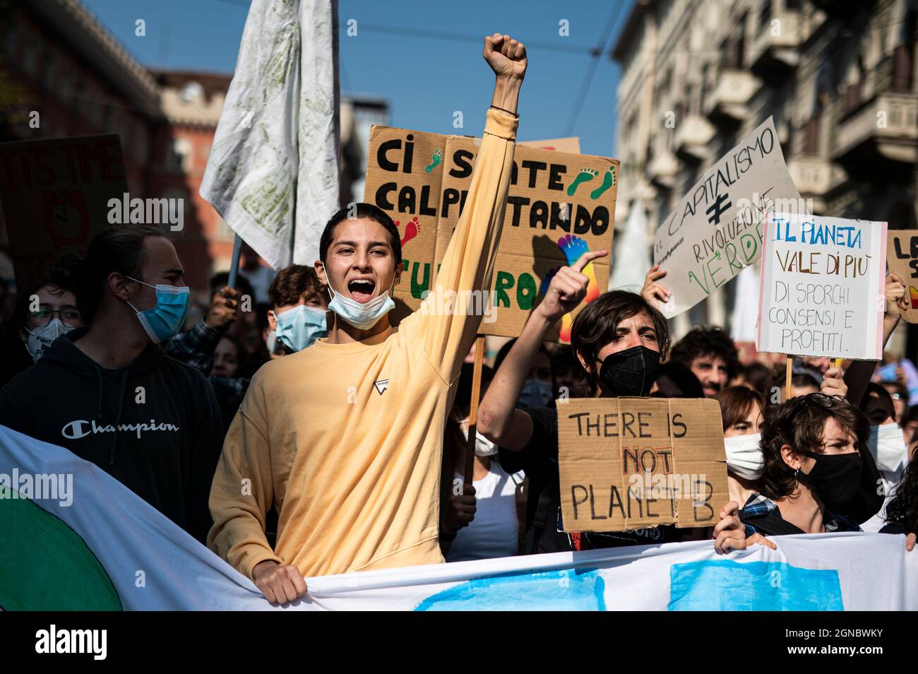 Turin, Italy. 24 September 2021. Climate activists gesture during 'Fridays for future' demonstration, a worldwide climate strike against governmental inaction towards climate breakdown and environmental pollution. Credit: Nicolò Campo/Alamy Live News Stock Photo
