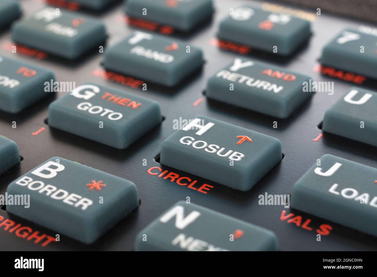Sinclair ZX Spectrum keyboard close-up. Focus on Basic GOSUB command key. Vintage 8-bit home computer from 1980s (see Notes). Stock Photo