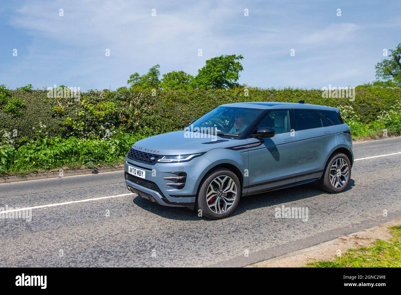 2021 grey Land Range Rover Evoque AB10 PHEV A R-Dynamic SE 1.5-litre three-cylinder Ingenium petrol engine car en-route to Capesthorne Hall classic May car show, Cheshire, UK Stock Photo