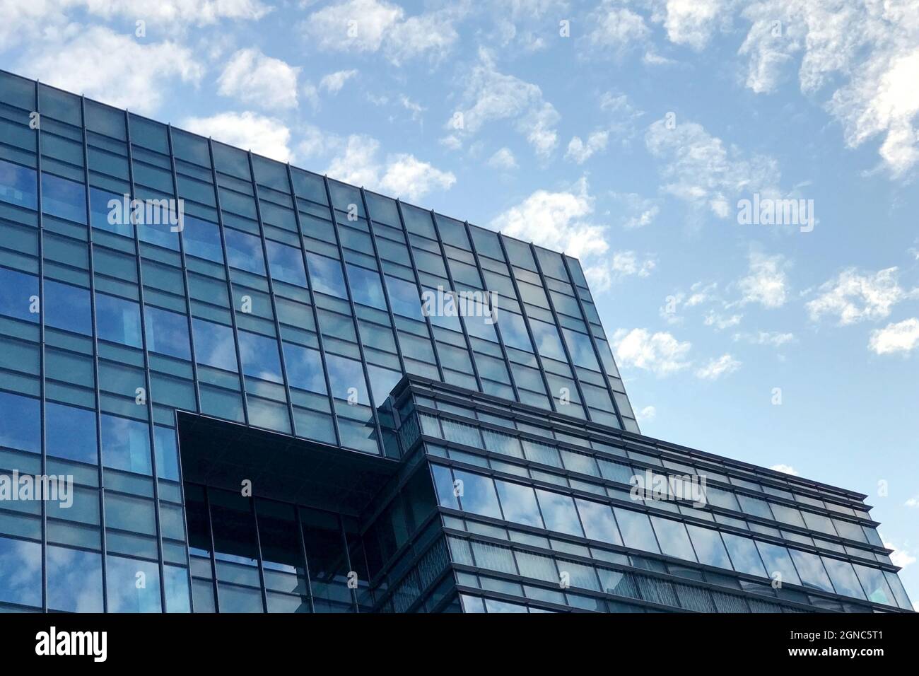Low angle shot of high-rise modern buildings under a cloudy sky Stock ...