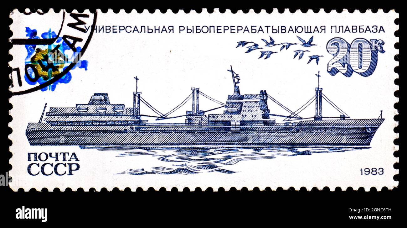 USSR - CIRCA 1983: A stamp printed in USSR Russia shows universal fish floating base ship, series Ships of the Soviet Fishing Fleet Stock Photo