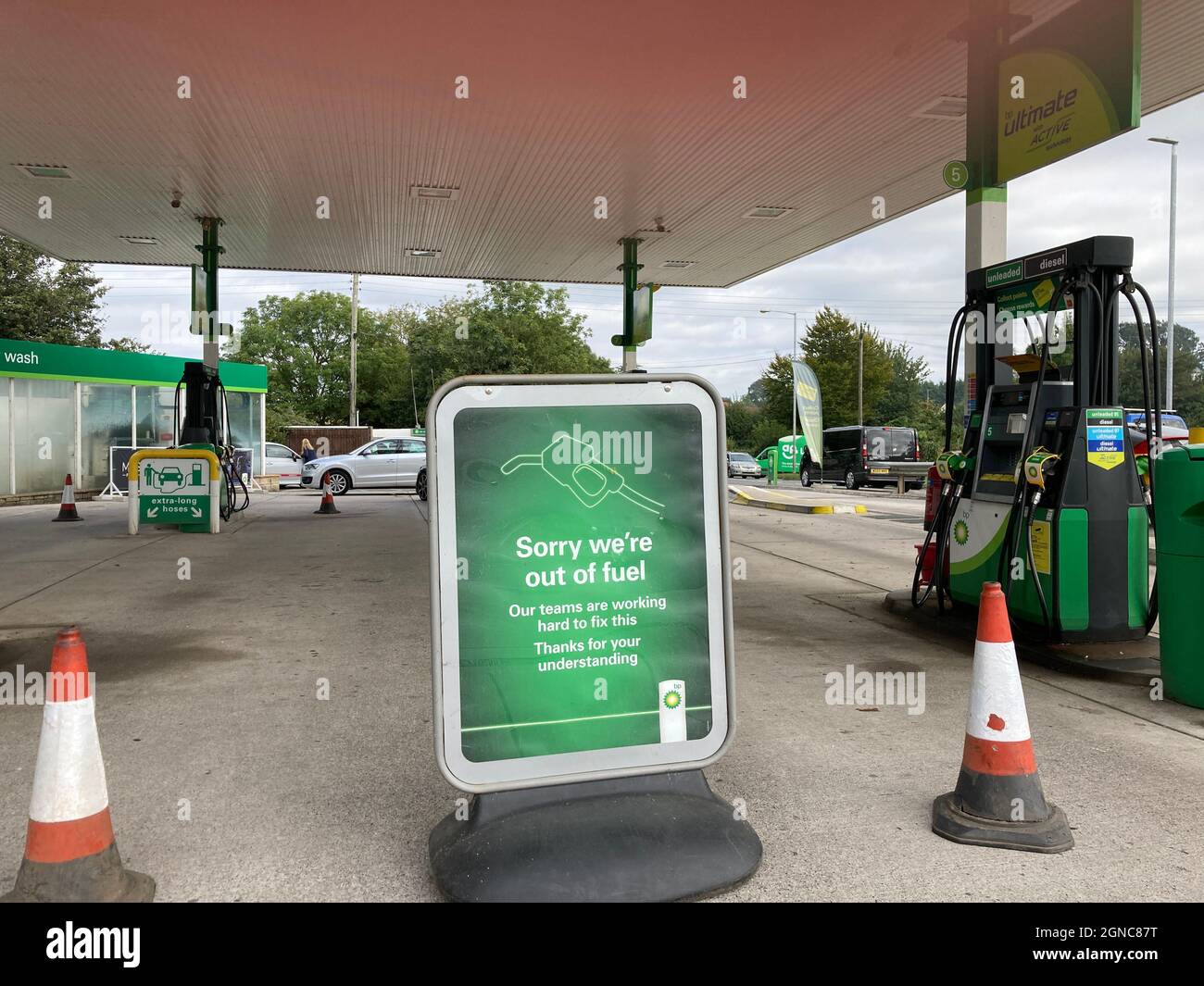 Yeovil, Somerset, England - September 24 2021: BP Service station forecourt with Sorry We Are Out of Fuel sign, due to the lack of HGV drivers Stock Photo