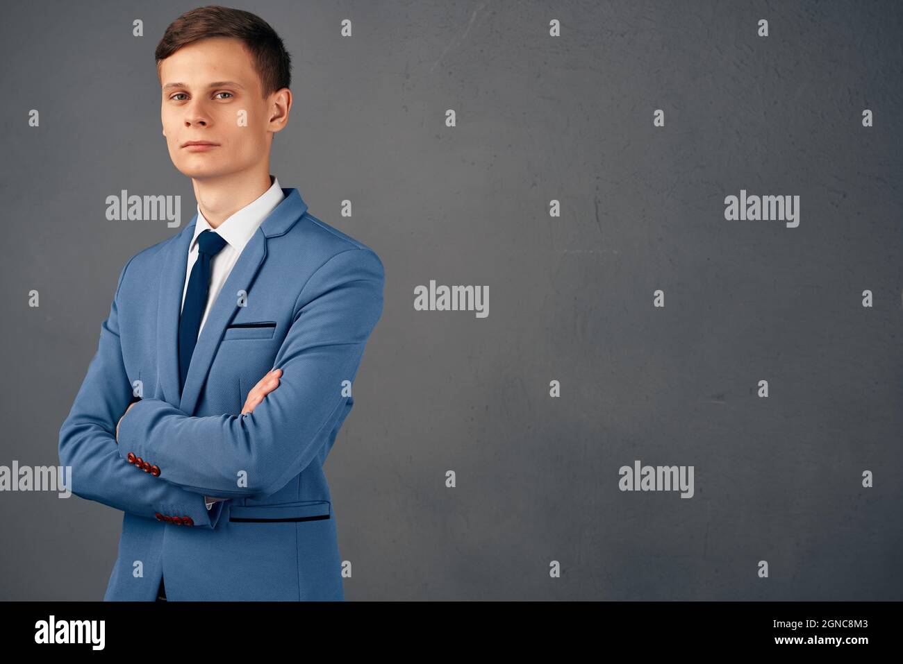 portrait of business man in suit posing studio isolated background ...