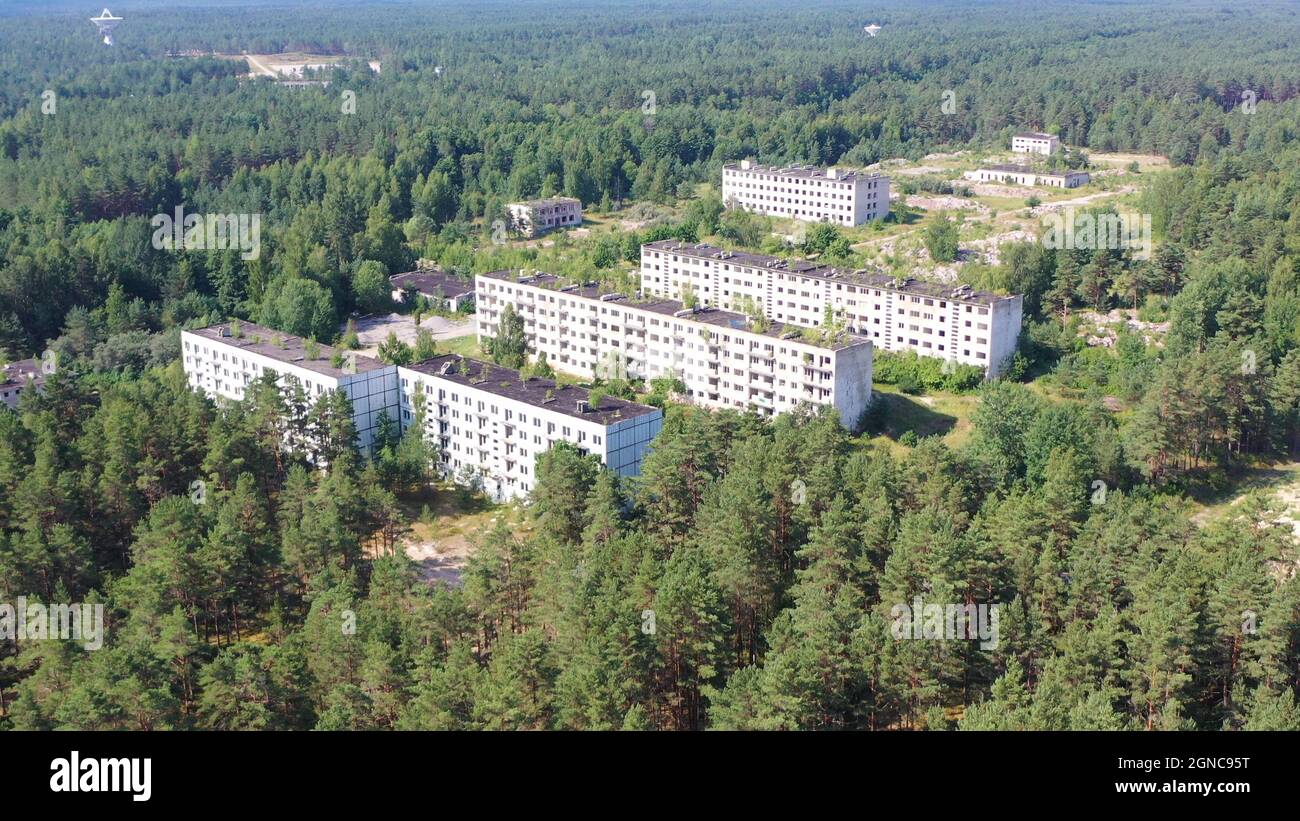 Aerial view of abandoned soviet military town Irbene in Latvia. Radio  telescope in background Stock Photo - Alamy