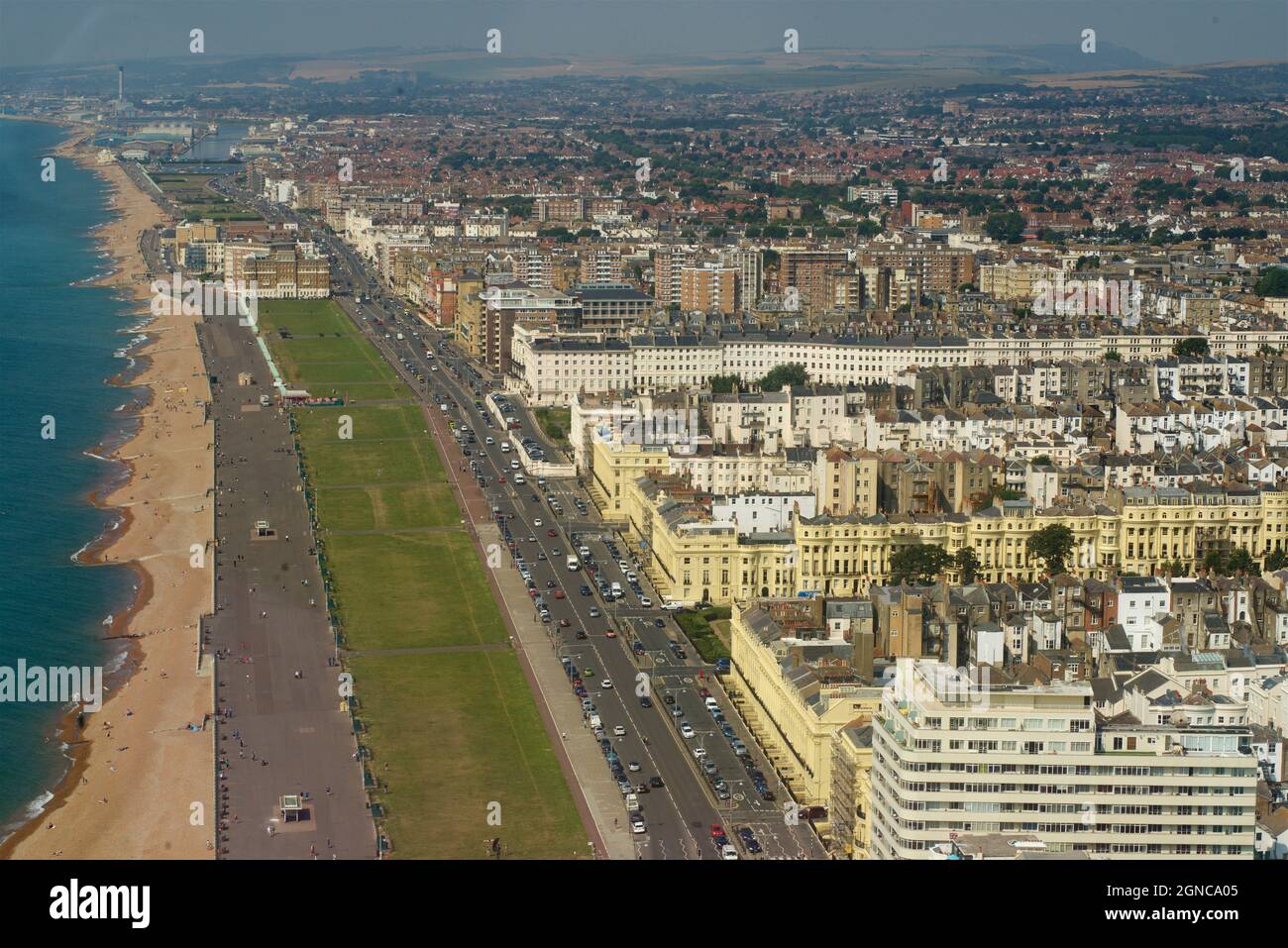 View from the i360 looking west towards Hove across the sea, beaches, lawns and townscape, with Brunswck Square and Terrace's Regency houses in cream, and the Art Deco Embassy Court bottom right. Brighton & Hove, East Sussex, England, UK Stock Photo