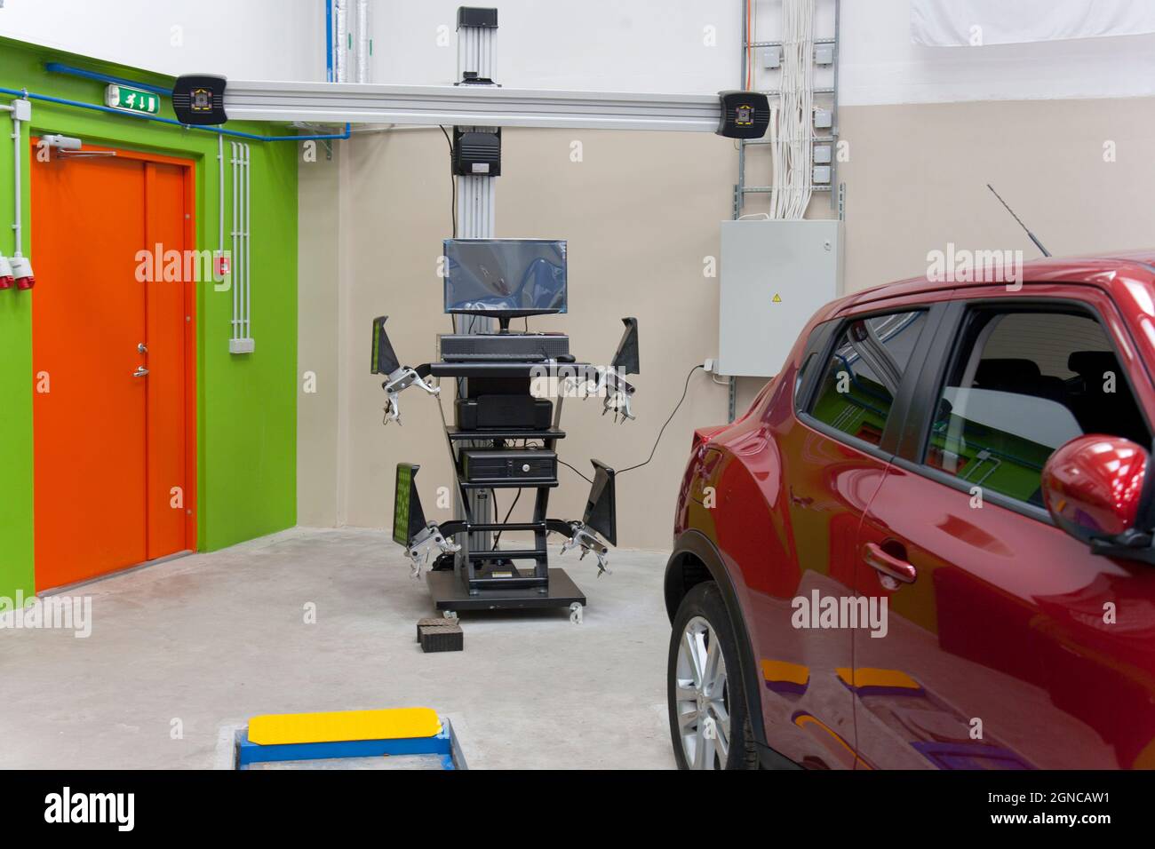 Car in a and a computer running diagnostics on the engine