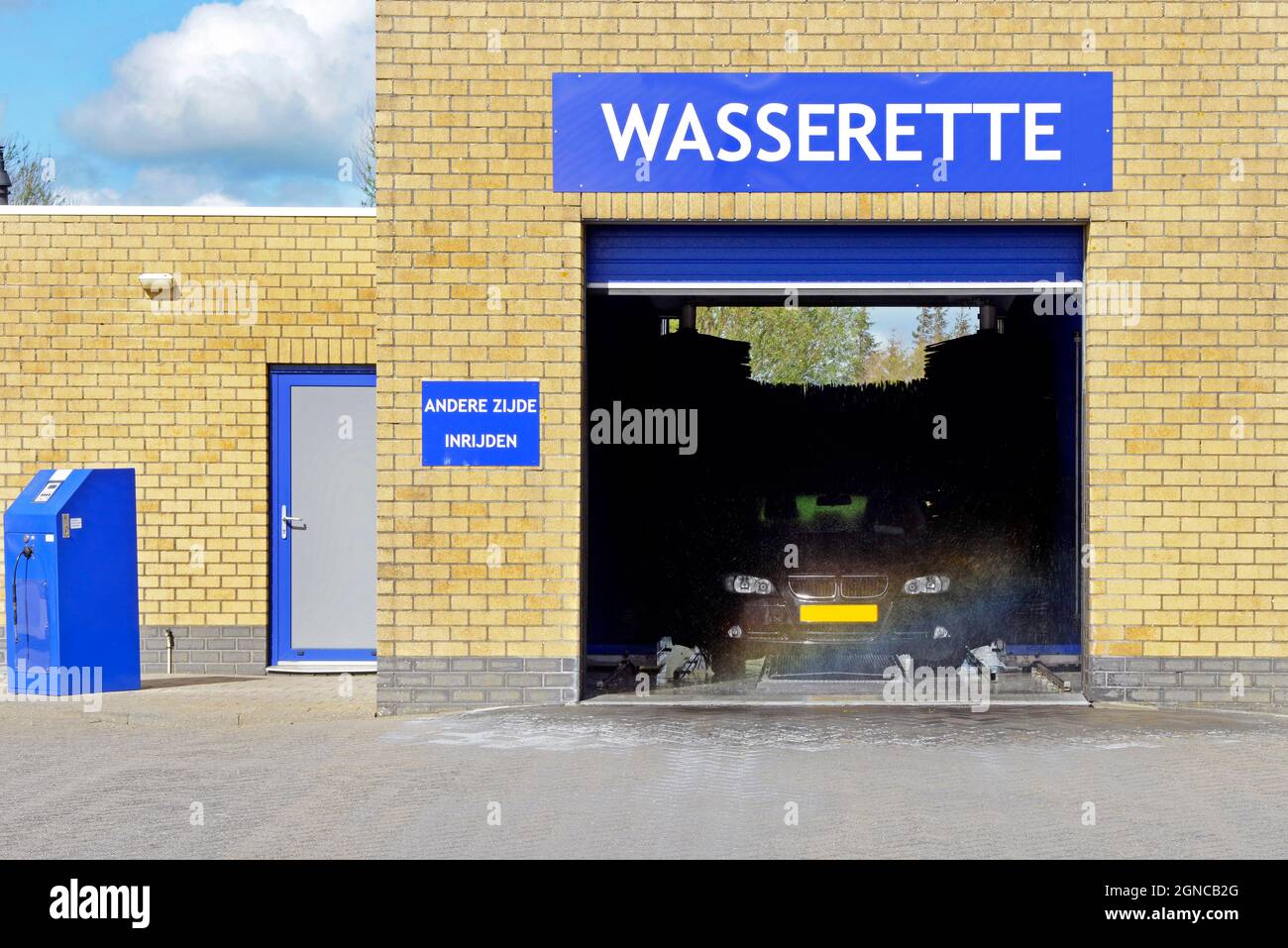 An automated car wash in operation with open door. Stock Photo