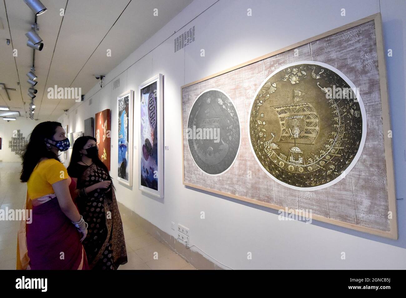 Dhaka. 24th Sep, 2021. People visit the National Art Exhibition in