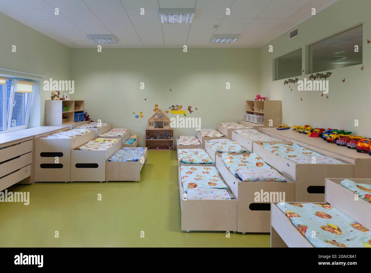 Modern day care nursery or preschool kindergarten school, bedrooms for nap time, pull out bunks