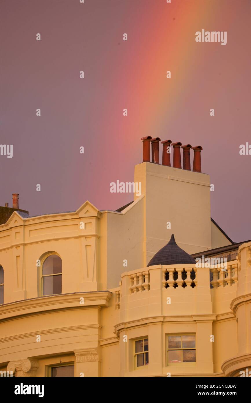 Regency architecture with a rainbow in the sky above. Elegant Georgian houses of Brunswick Square, Hove East Sussex, England Stock Photo