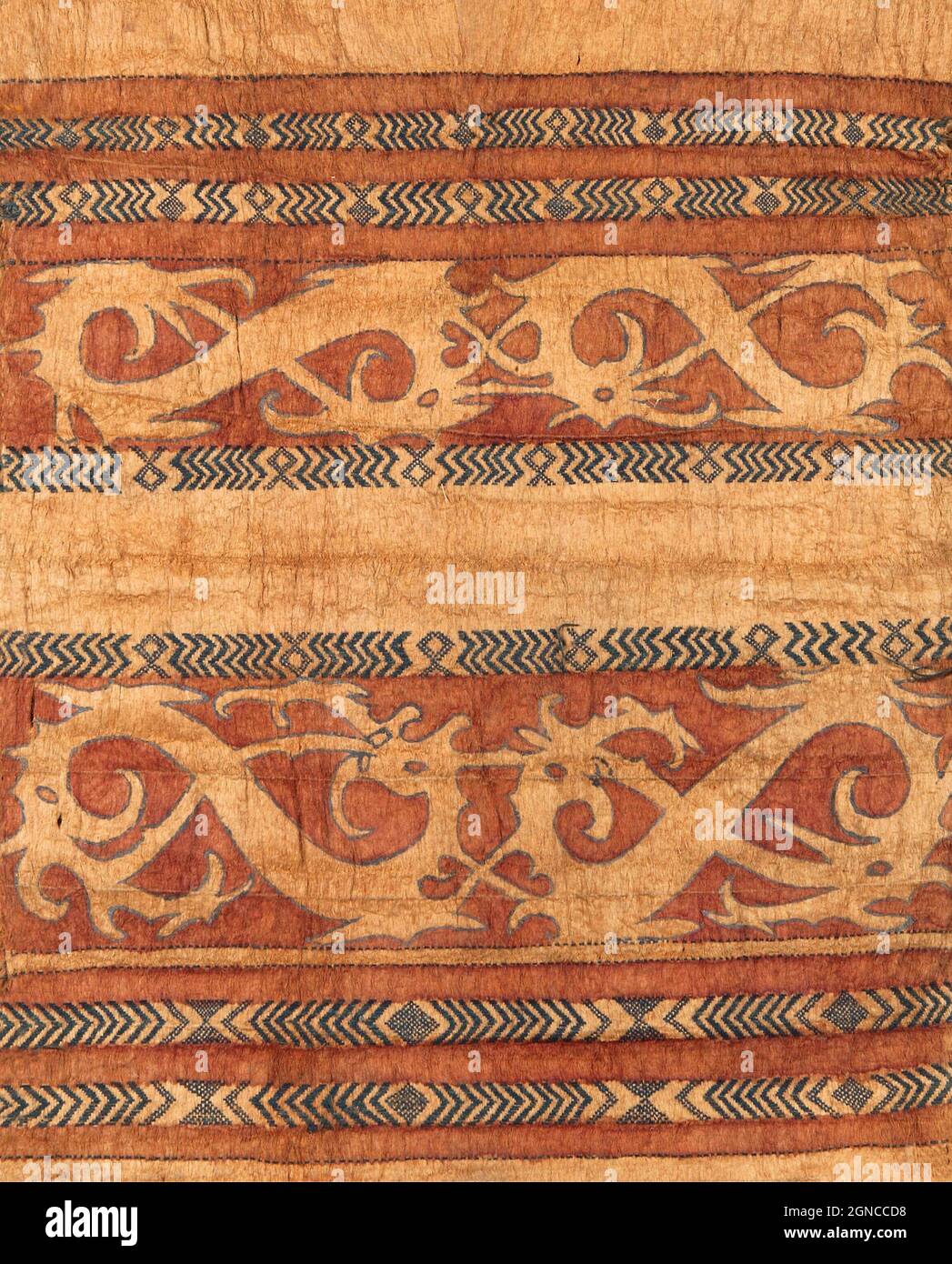 Detail of a Dayak jacket made of beaten bark. This kind of barkcloth clothing was widely worn by various Dayak peoples. However, these were mostly undecorated. Those with decorations like this were intended for the upper classes. They probably wore these jackets on special occasions. The water serpent, also known as the dragon or naga, was a symbol of various Dayak sub-groups. Stock Photo
