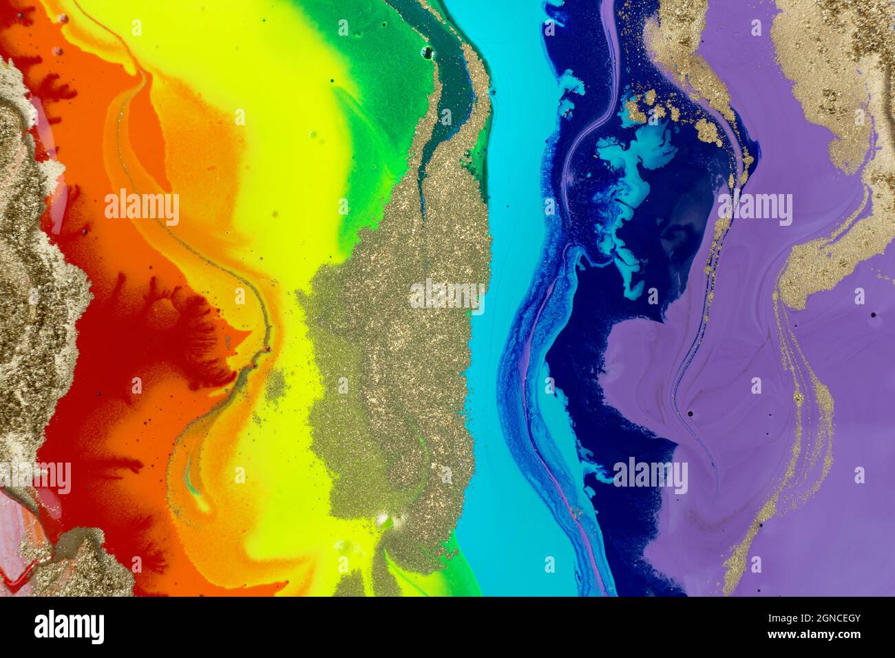 Rainbow liquid acrylic mixed ink texture with gold dust Stock Photo - Alamy