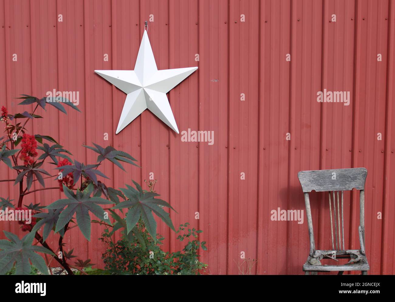 Country Living white star on a red barn. Stock Photo