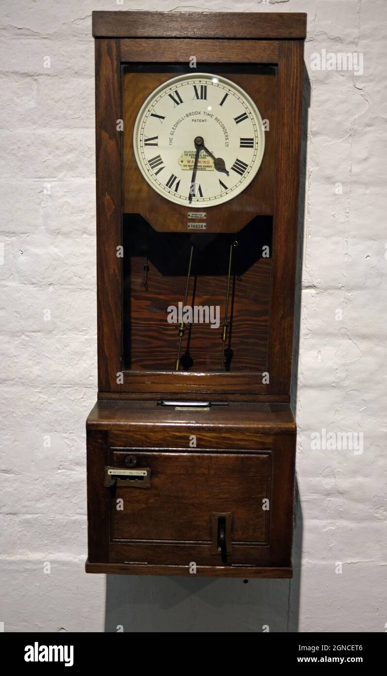 Clocking in clock, Salt's Mill, Saltaire, West Yorkshire, World heritage site Stock Photo