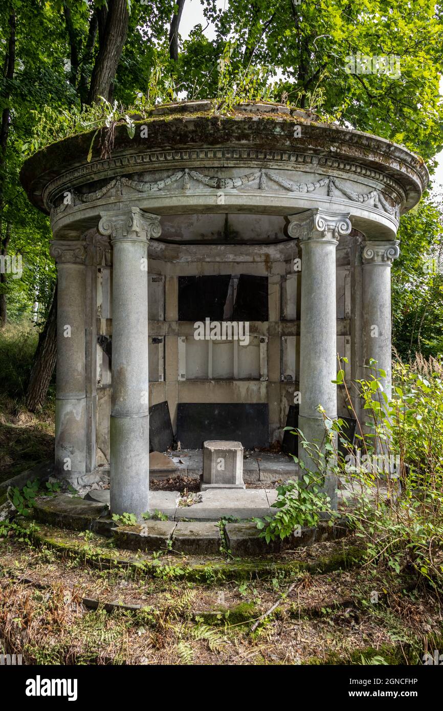 Abandoned burial chamber - columbarium in forest Stock Photo