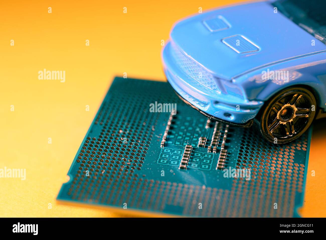 Close up view of a blue toy car on top of a microprocessor Stock Photo ...