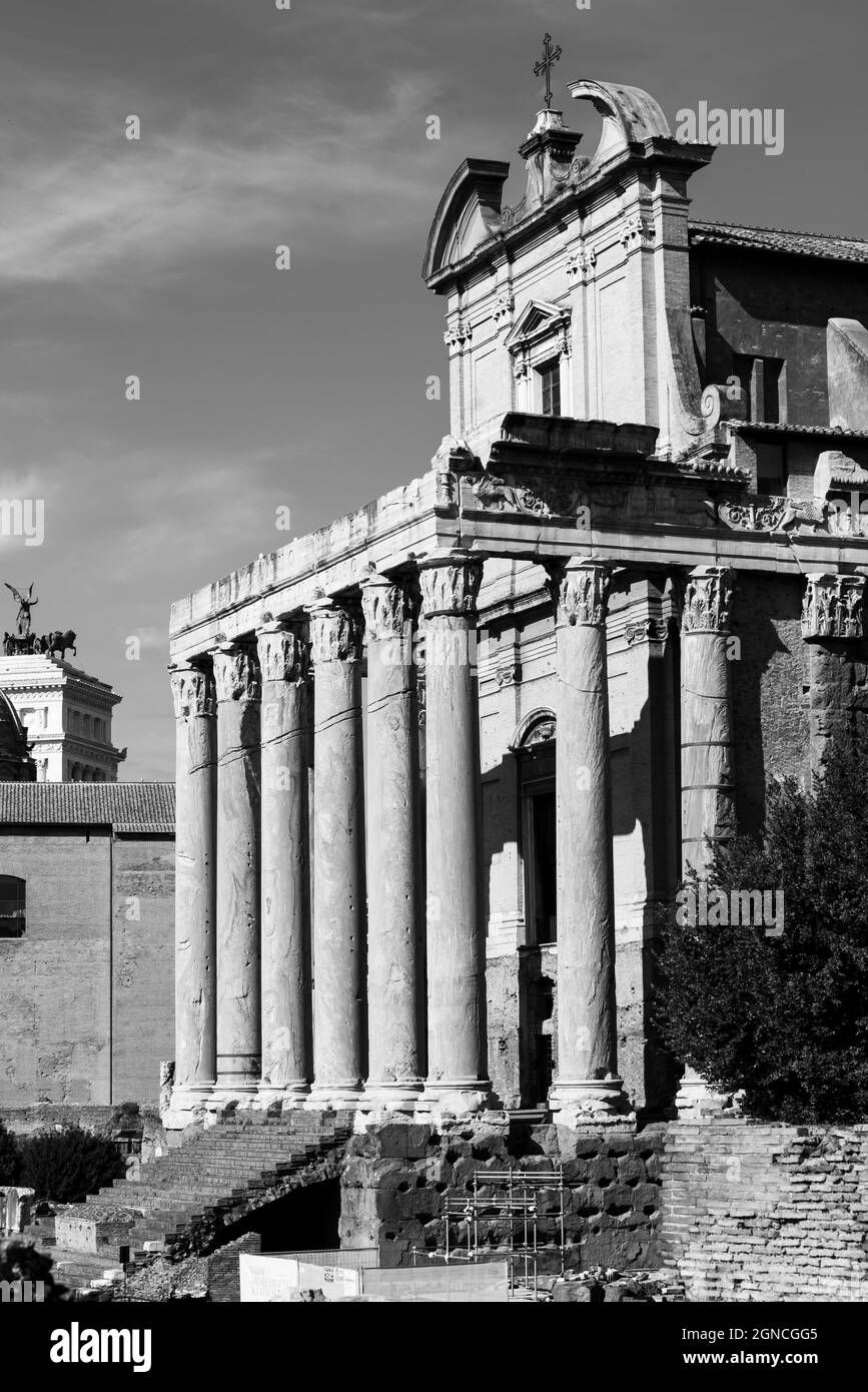 Black and white photo of ancient roman columns used to decorate the entrance of medieval church in Rome Stock Photo