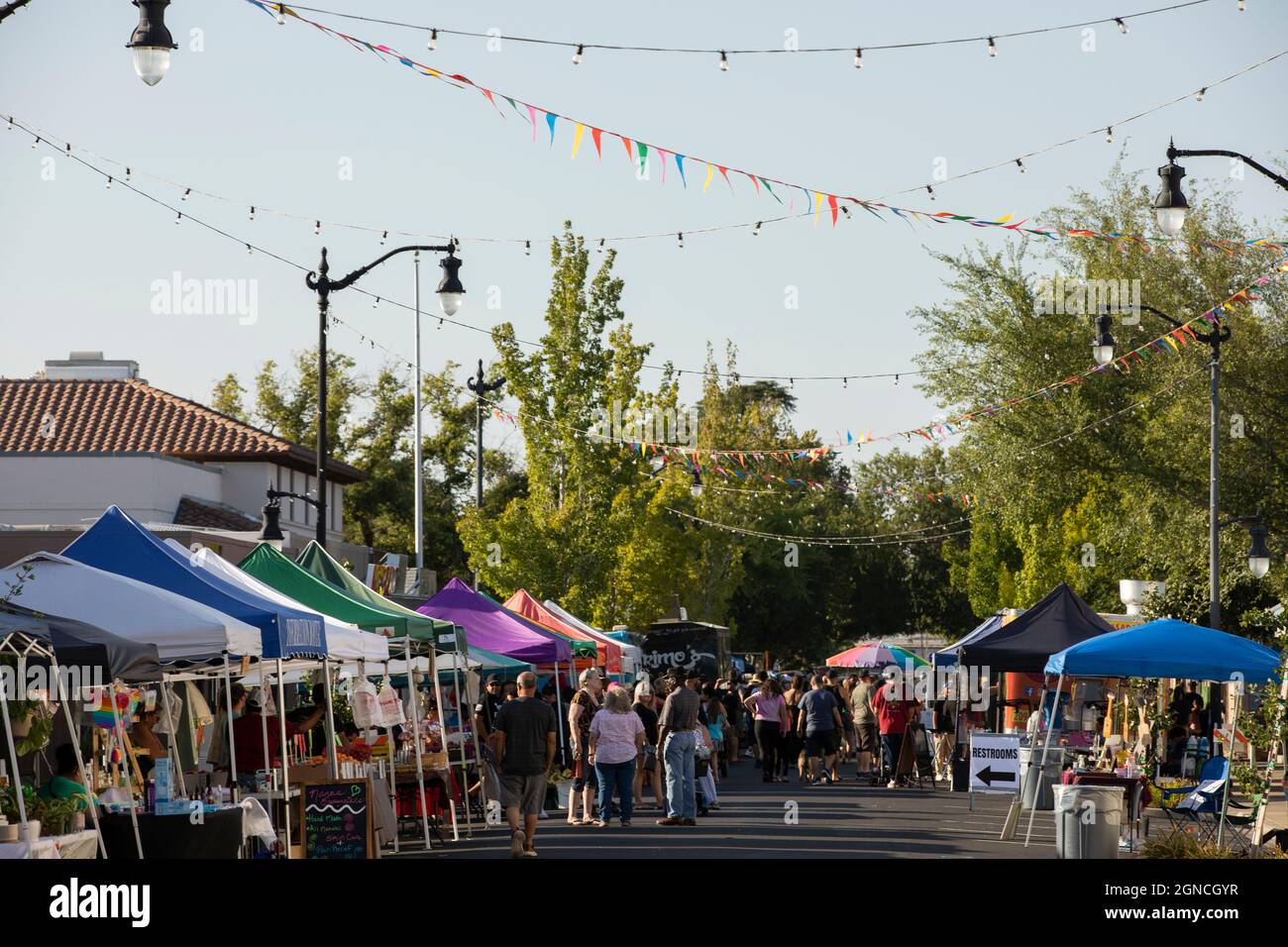 Manteca, California, USA July 15, 2021 People attend a street fair