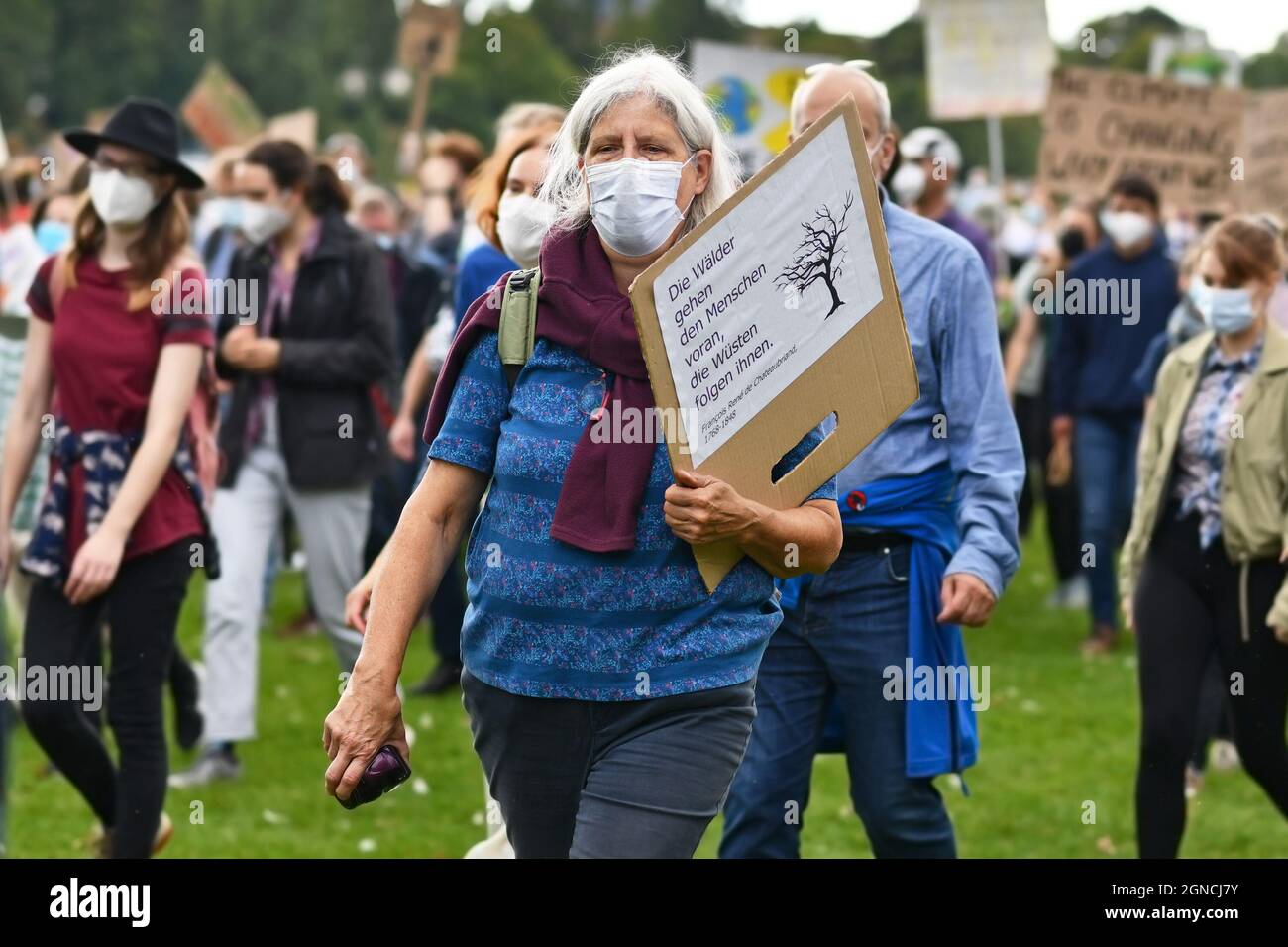 Heidelberg, Germany - 24th September 2021: Elderly lady with protest sign at Global Climate Strike demonstration Stock Photo