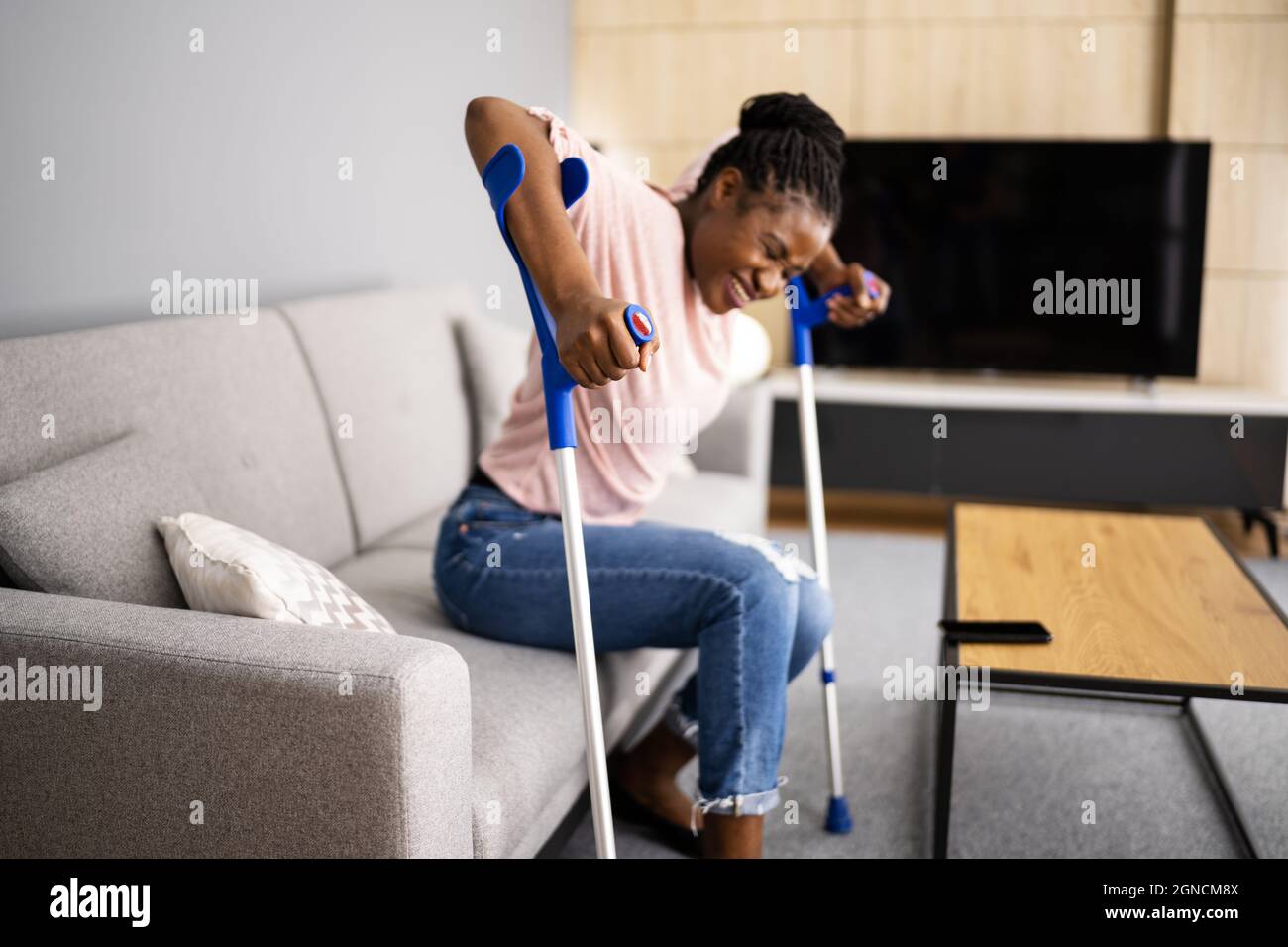 Walking With Crutches. Injured Broken Leg Or Knee Stock Photo Alamy