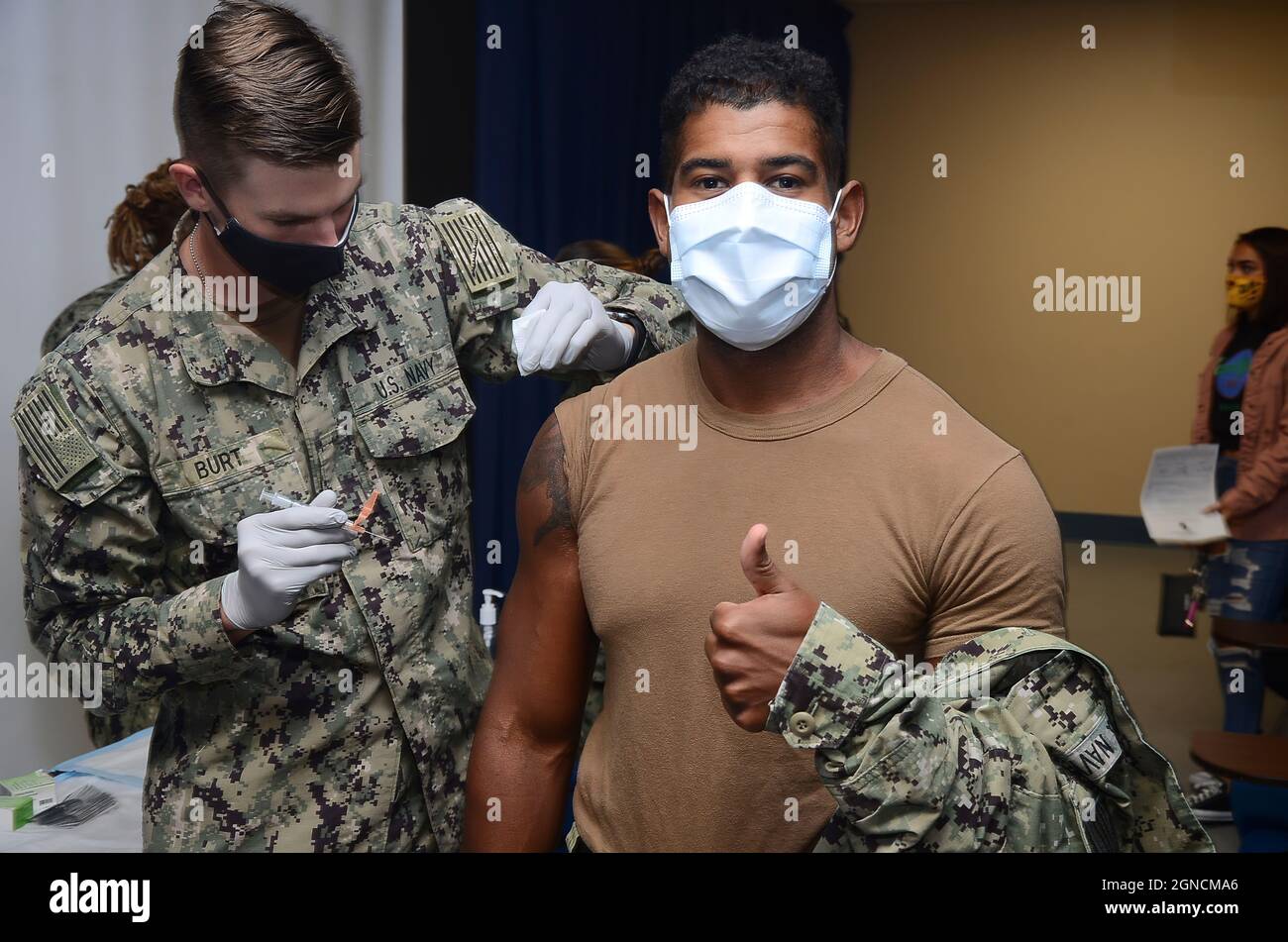 CORPUS CHRISTI, Texas (Sept. 30, 2020) Hospitalman Brandon Burt administers an influenza vaccination to Hospitalman Edward Roy during a flu shot standdown at Navy Medicine Readiness and Training Command Corpus Christi. Impacts of the COVID-19 pandemic have stressed the importance of the flu vaccine, and while the COVID-19 and influenza viruses are different, symptoms of the two can look the same, making it difficult to differentiate the two based on symptoms alone. Getting a flu shot now could help reduce the overall impact of contagious respiratory illnesses on the population and decrease the Stock Photo