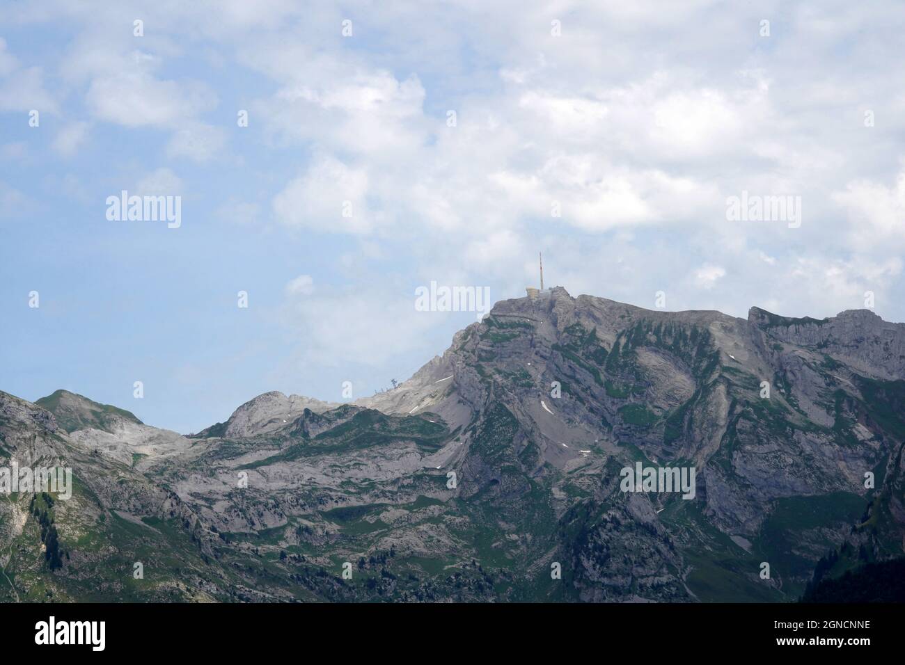 Panoramic view of Saentis mountain in Switzerland in summer time. It is an important landmark of the region and one of the highest mountains in Alps. Stock Photo