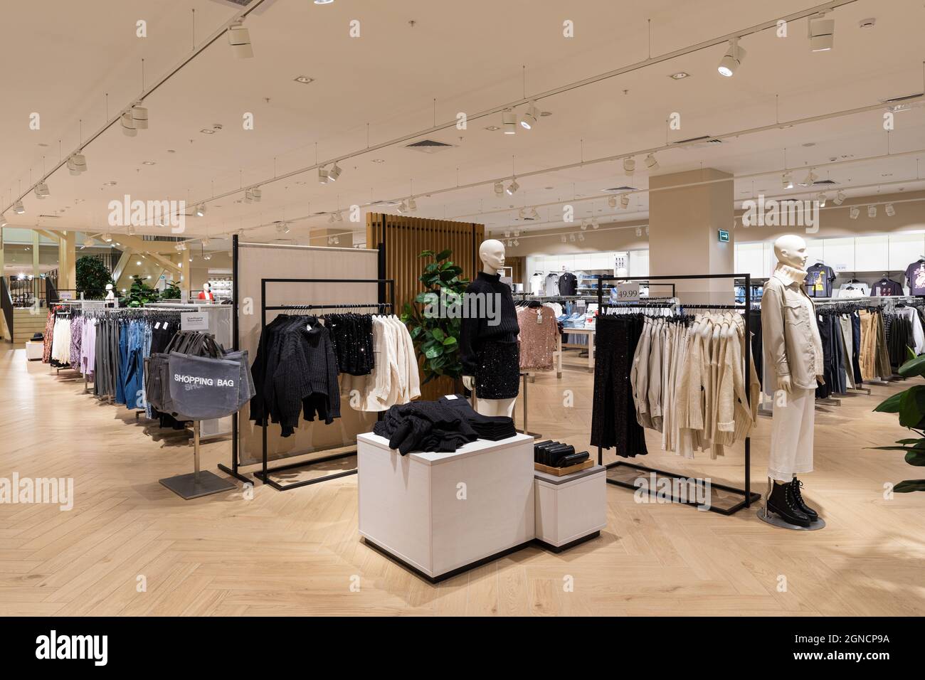 Modern fashionable brand interior of men and women clothing shop store  inside shopping center Stock Photo - Alamy