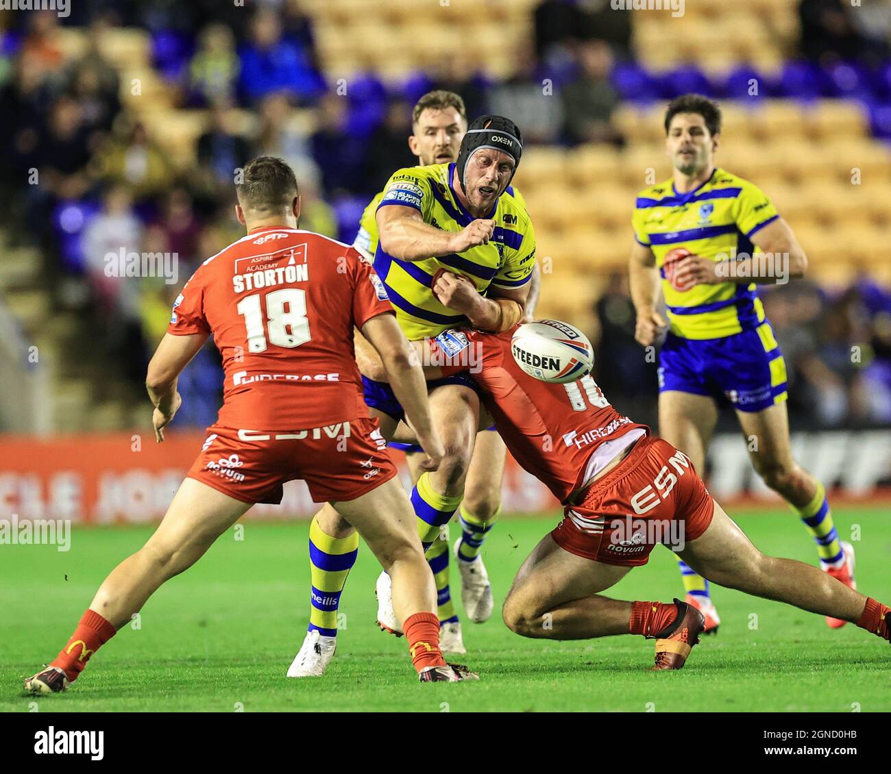 King (16) of Hull KR forces Chris Hill (8) of Warrington Wolves to drop the ball as he