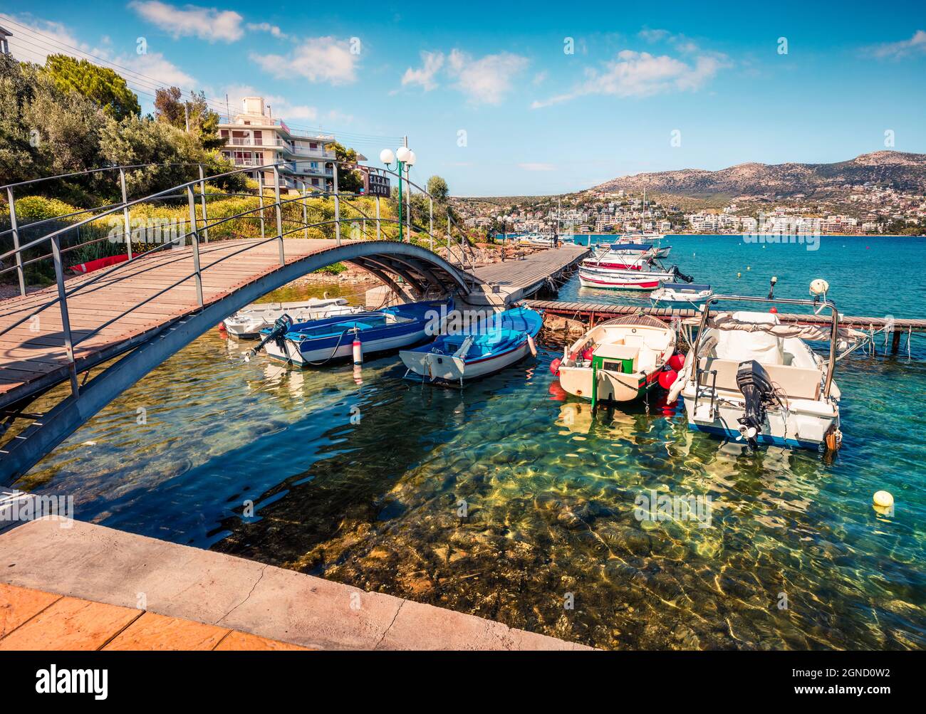 Colorful spring scene of the Porto Rafti port. Sunny morning seascape of Aegean sea, Greece. Traveling concept background. Stock Photo
