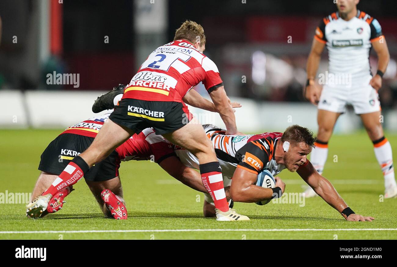 Leicester Tigers Hanro Liebenberg is tackled by Gloucester's Harry Elrington and Jack Singleton during the Gallagher Premiership match at the Kingsholm Stadium, Gloucester. Picture date: Friday September 24, 2021. Stock Photo