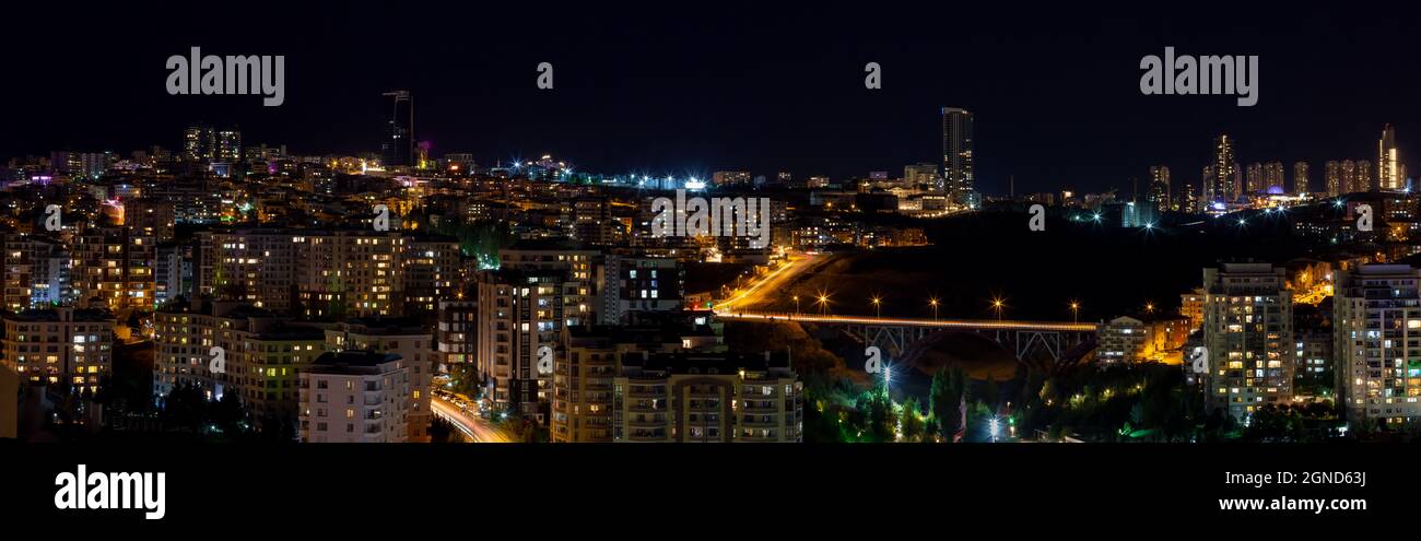 Beautiful panoramic cityscape of Cankaya, Oran and Dikmen districts in Ankara at night. Long exposure photography of Dikmen Valley Bridge. Stock Photo