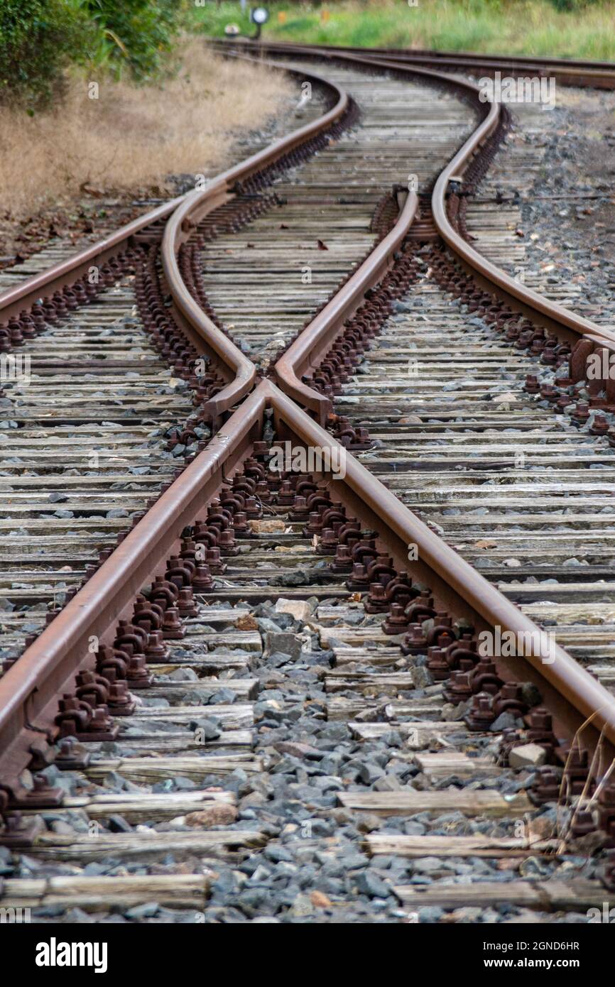 Old rusty train tracks with a switch Stock Photo