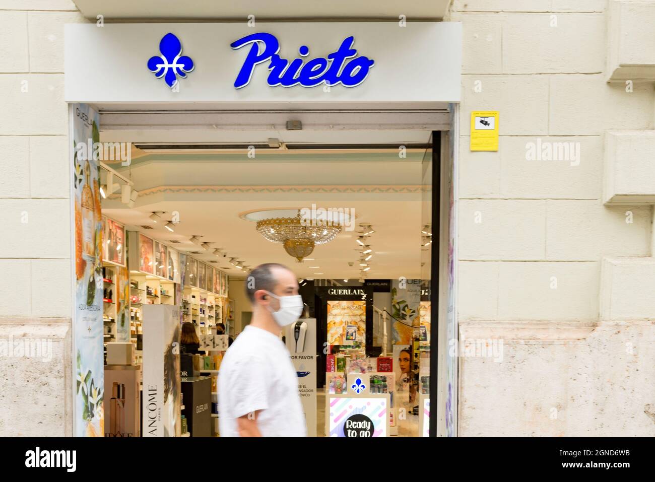 A man walks past the Prieto cosmetics store in Valencia Stock Photo - Alamy