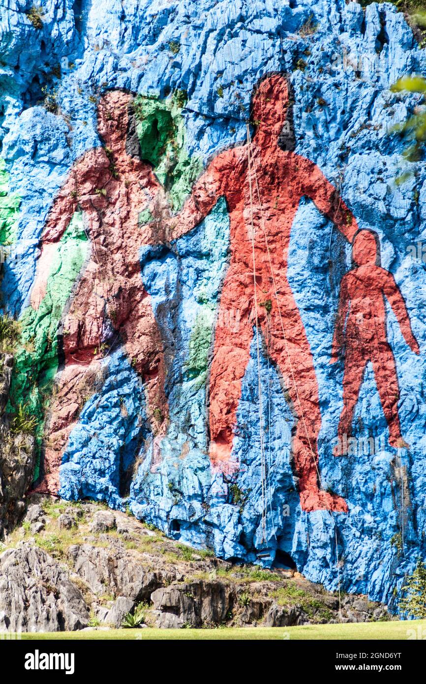 Mural de la Prehistoria The Mural of Prehistory painted on a cliff face in the Vinales valley, Cuba. Stock Photo