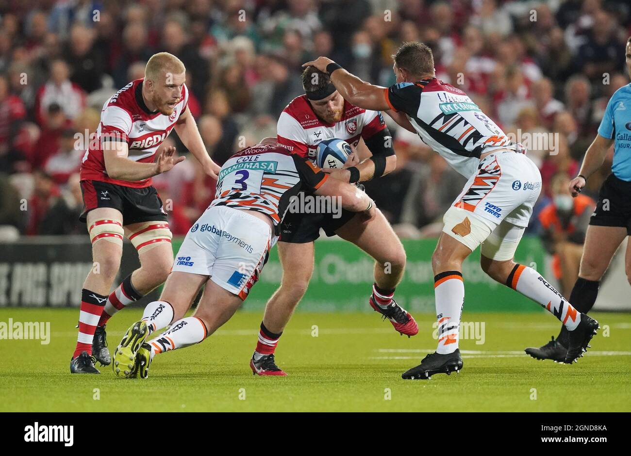 Gloucester's Harry Elrington is tackled by Leicester Tigers Hanro Liebenberg during the Gallagher Premiership match at the Kingsholm Stadium, Gloucester. Picture date: Friday September 24, 2021. Stock Photo