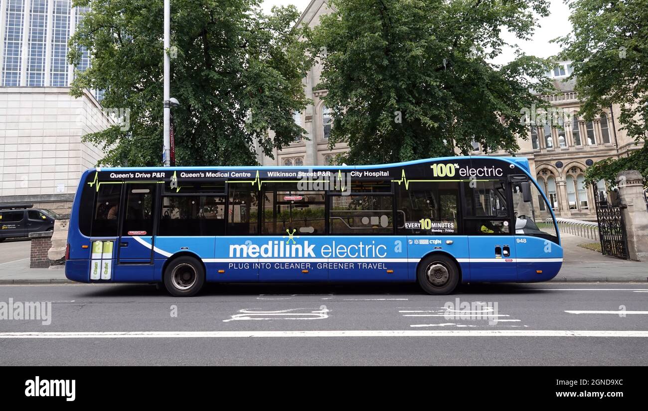 NOTTINGHAM, UNITED KINGDOM - Jul 29, 2021: A medicine electric-powered bus on a road to Nottingham City Hospital Stock Photo