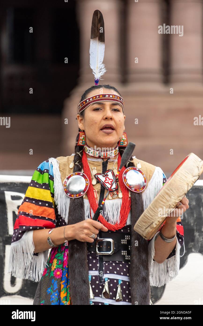 First Nations of Canada female singer performing during the Global Climate March organized by Fridays For Future in front of the Provincial Legislative Stock Photo