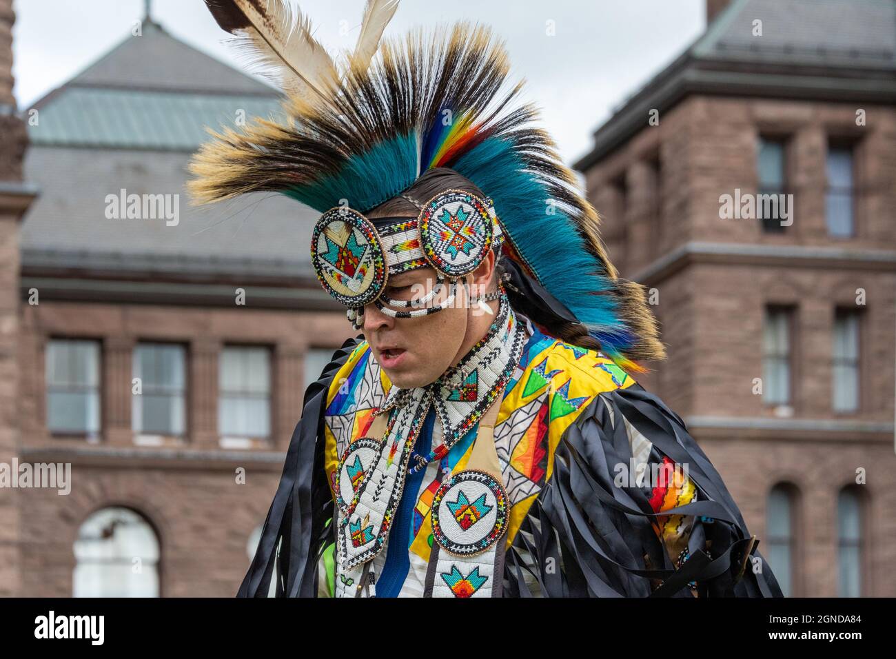 First Nations of Canada male dancer performing during the Global Climate March organized by Fridays For Future in front of the Provincial Legislative Stock Photo