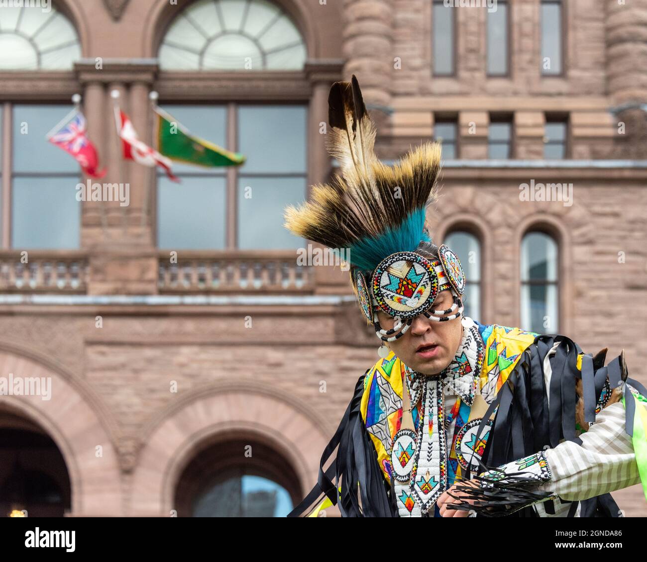 First Nations of Canada male dancer performing during the Global Climate March organized by Fridays For Future in front of the Provincial Legislative Stock Photo