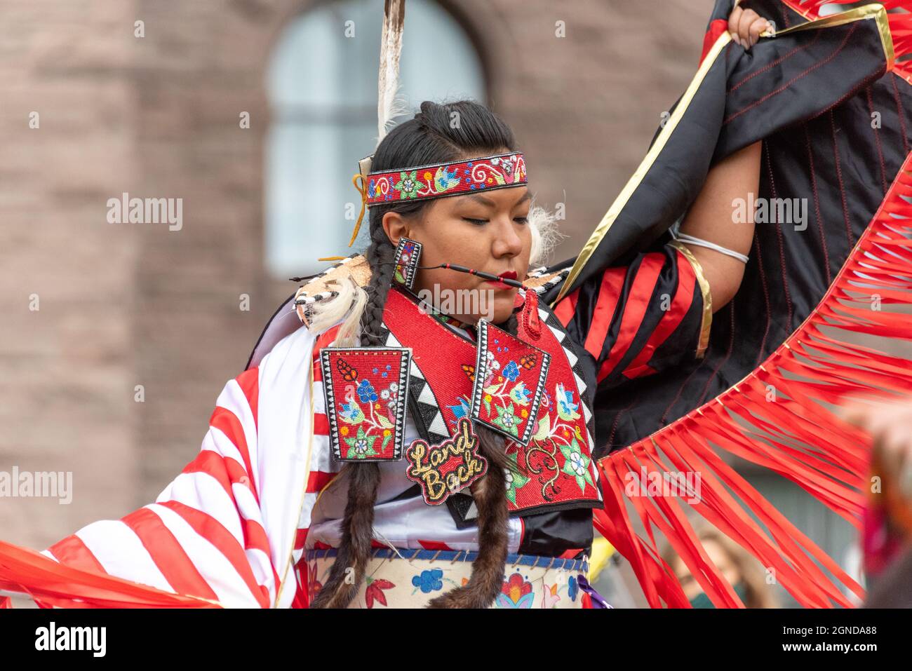 First Nations of Canada female dancer performing during the Global Climate March organized by Fridays For Future in front of the Provincial Legislativ Stock Photo