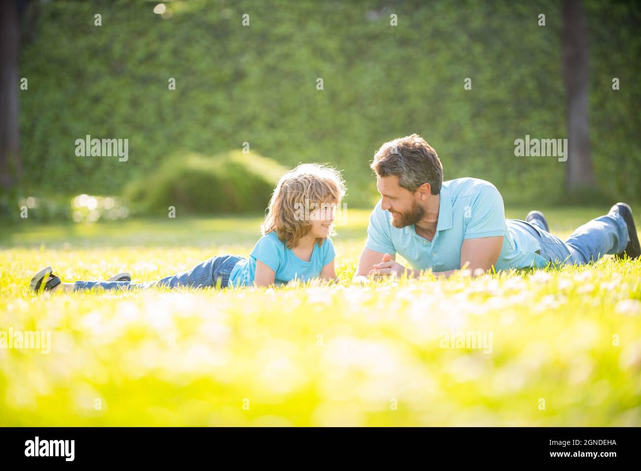 fathers day. happy father and son having fun in park. family value. childhood and parenthood. Stock Photo