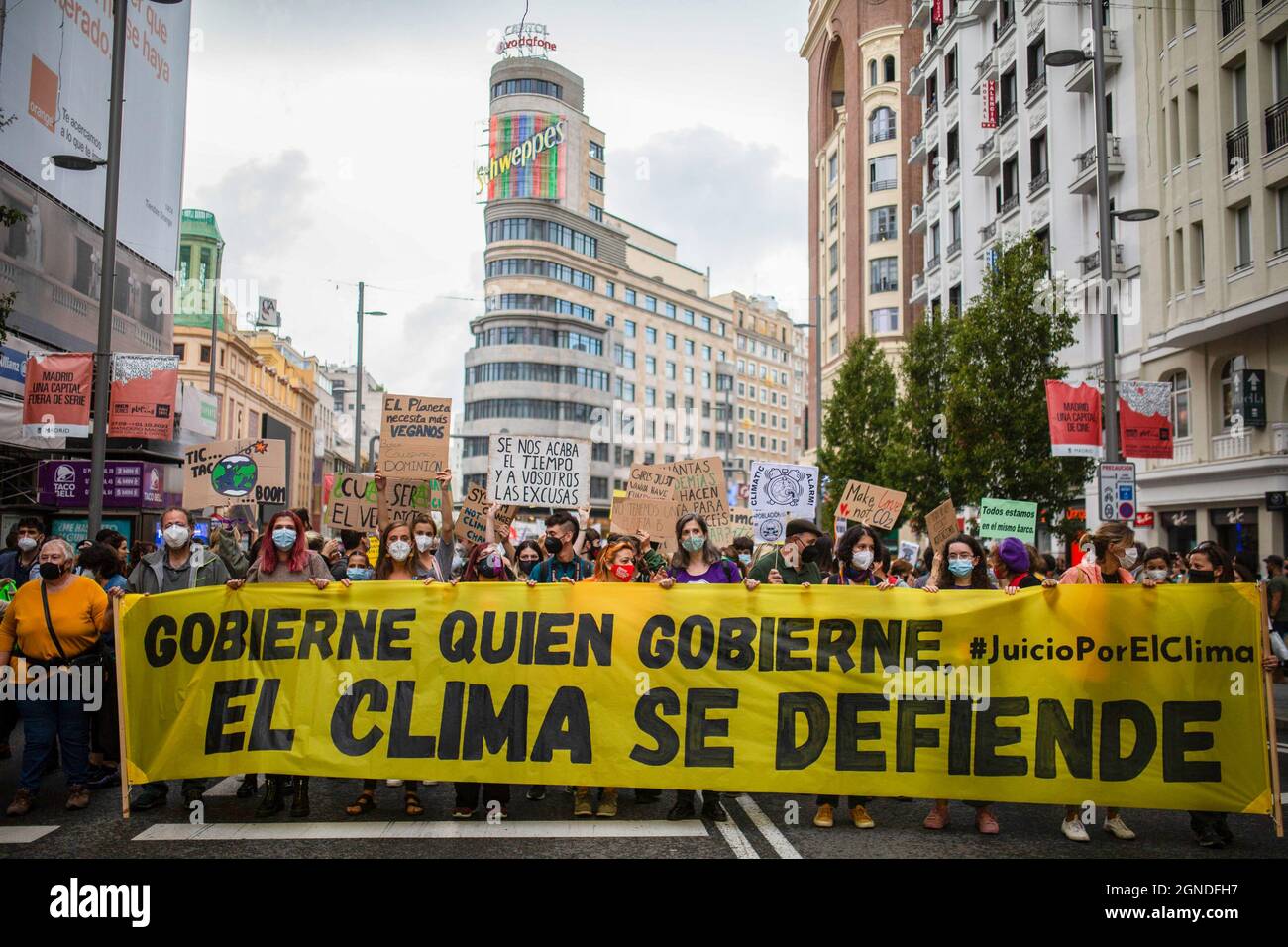 Madrid, Spain. 24th Sep, 2021. Protesters seen with a huge banner marching along Gran Via street during the demonstration. The global protest was driven by the Fridays for Future movement to demand urgent action. In Spain, the complaint filed by various organizations before the Supreme Court against the Government for the lack of commitment and ambition to stop the climate emergency is added. (Photo by Luis Soto/SOPA Images/Sipa USA) Credit: Sipa USA/Alamy Live News Stock Photo