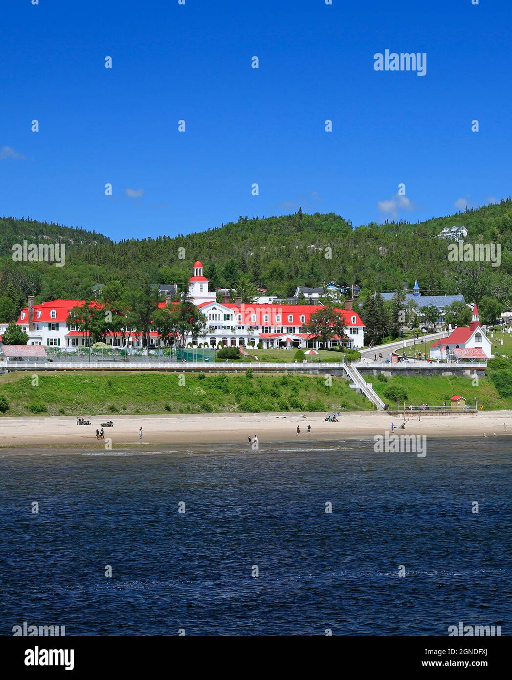 Tadoussac skyline with beach and Saguenay Fjord river on the foreground, Quebec, Canada Stock Photo