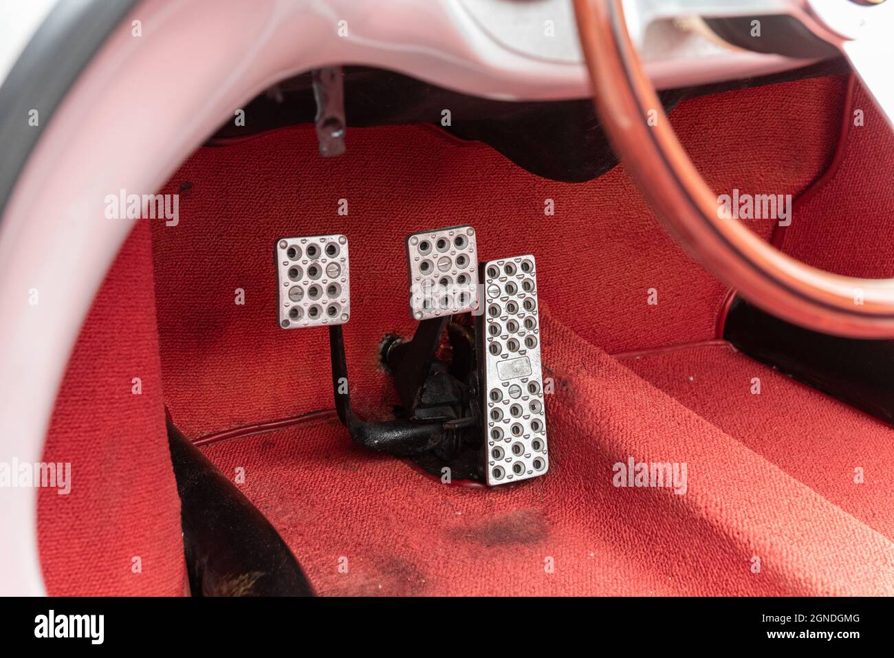 Drivers seat floor pedals control the brakes, acceleration, and clutch