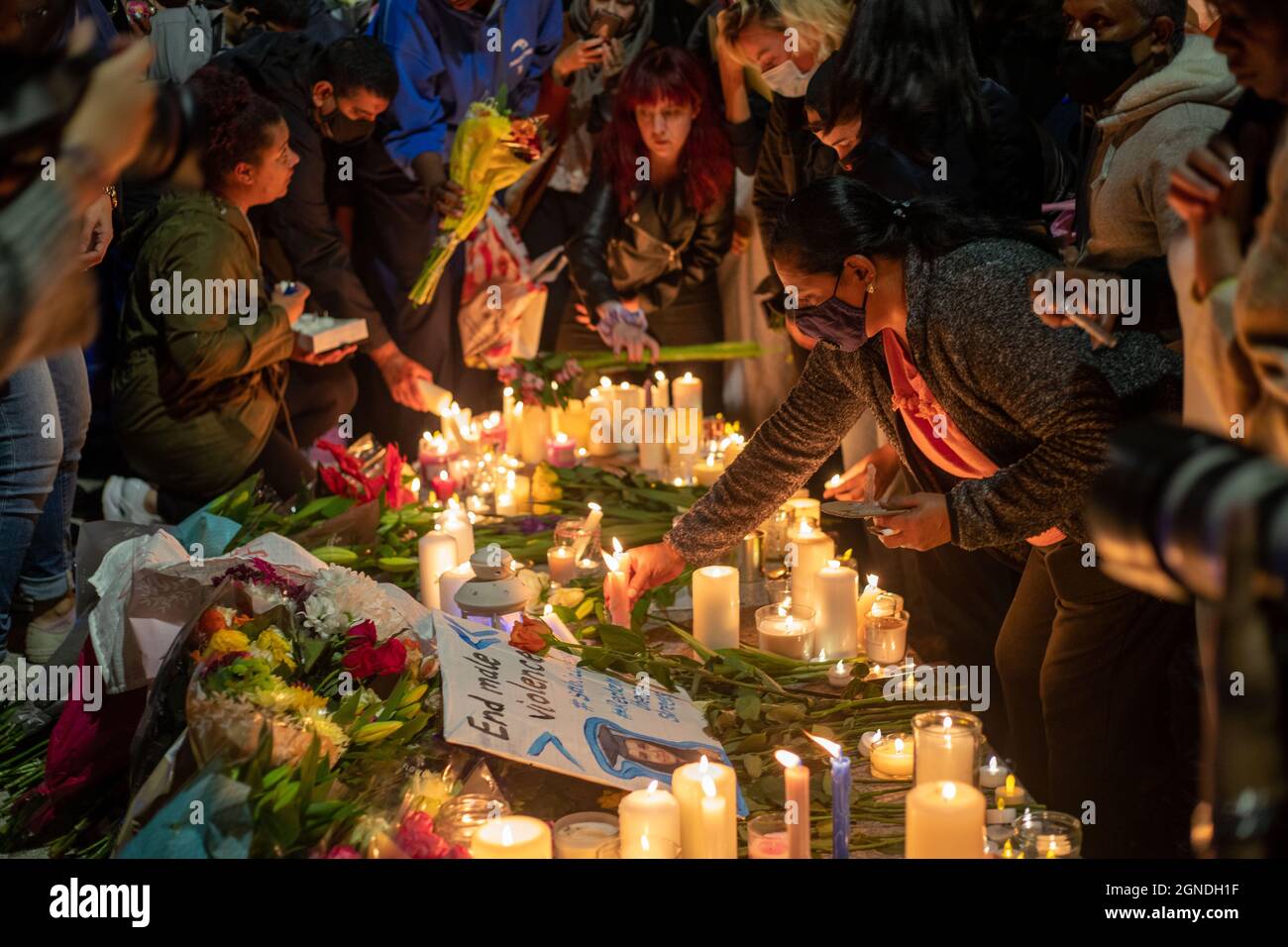 London, UK. September 24 2021 Flowers and tributes laid at candle lit vigil held on Pegler Square, Kidbrooke South-East London for murder victim Sabina Nessa Credit: Lucy North/Alamy Live News Stock Photo