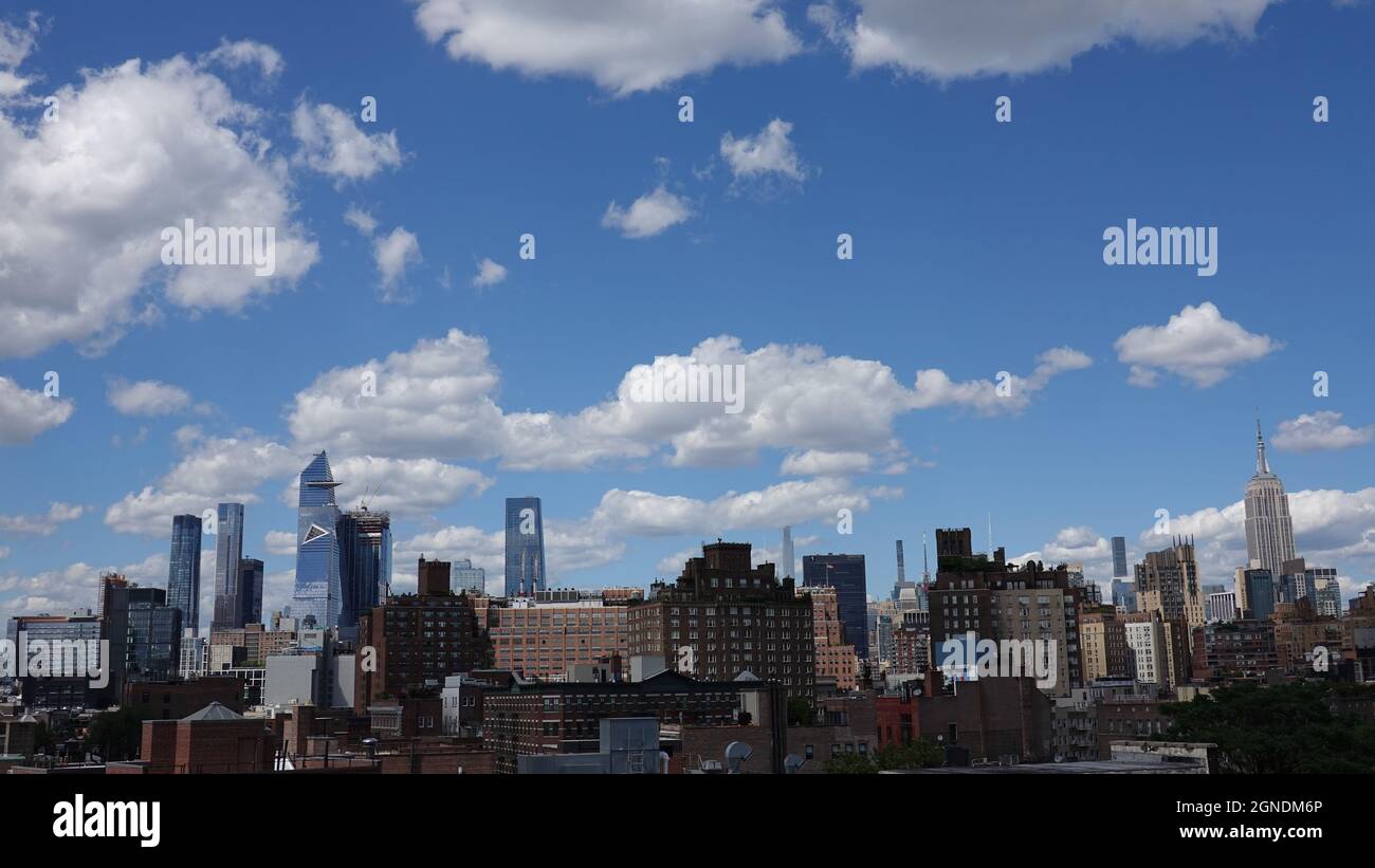 Daytime New York City Skyline With Blue Sky and Fluffy Clouds Stock ...