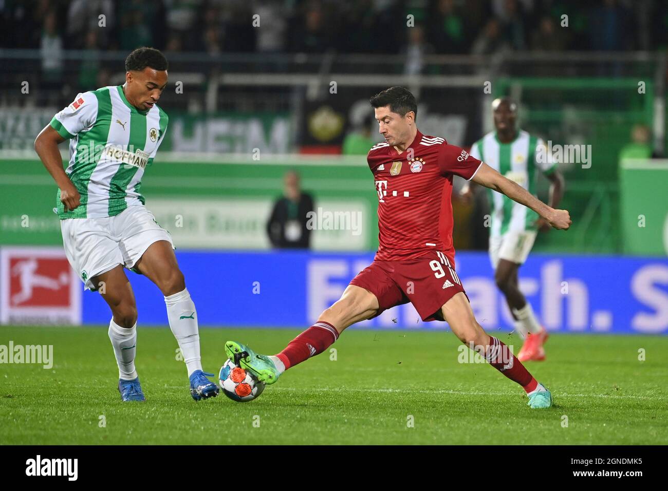 Feurth, Germany. 24th Sep, 2021. Fuerth, Deutschland. 24th Sep, 2021.  Robert LEWANDOWSKI (FC Bayern Munich), action, duels versus Jamie LEWELING ( Fuerth). Soccer 1st Bundesliga season 2021/2022, 6th matchday, matchday06,  Greuther Furth -