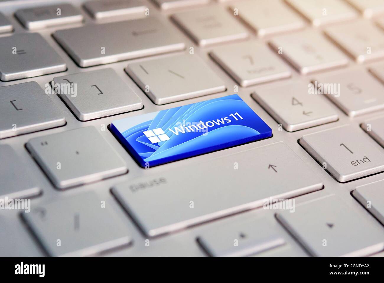 June 23, 2021. Barnaul, Russia. button with the logo Windows 11 on the grey keyboard of a modern laptop. Stock Photo