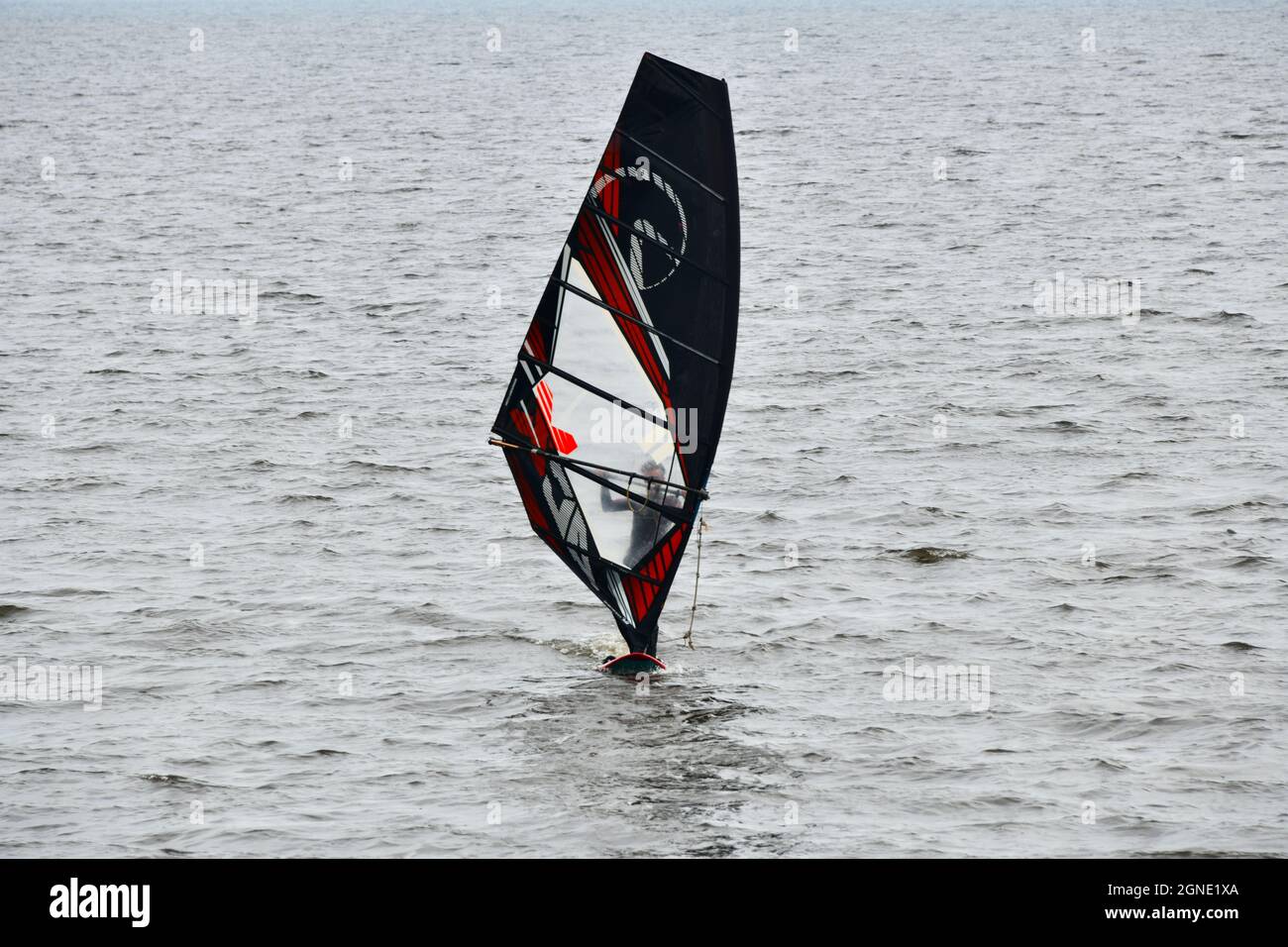 A man wind surfing in a Bay of the Great Lake Superior at Mission Marsh in Thunder Bay, Ontario, Canada, North America. Stock Photo