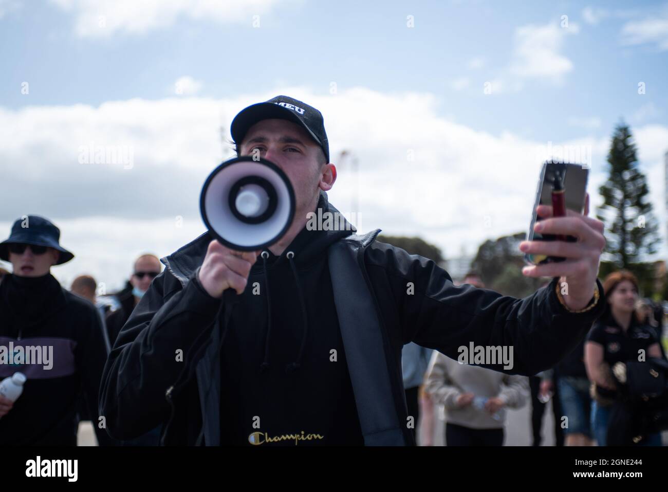Melbourne, Australia. 25th Sep, 2021. 25th September 2021, Melbourne, Australia. A protester holds a megaphone at an attempted 'Millions March for Freedom' rally. Credit: Jay Kogler/Alamy Live News Credit: Jay Kogler/Alamy Live News Stock Photo